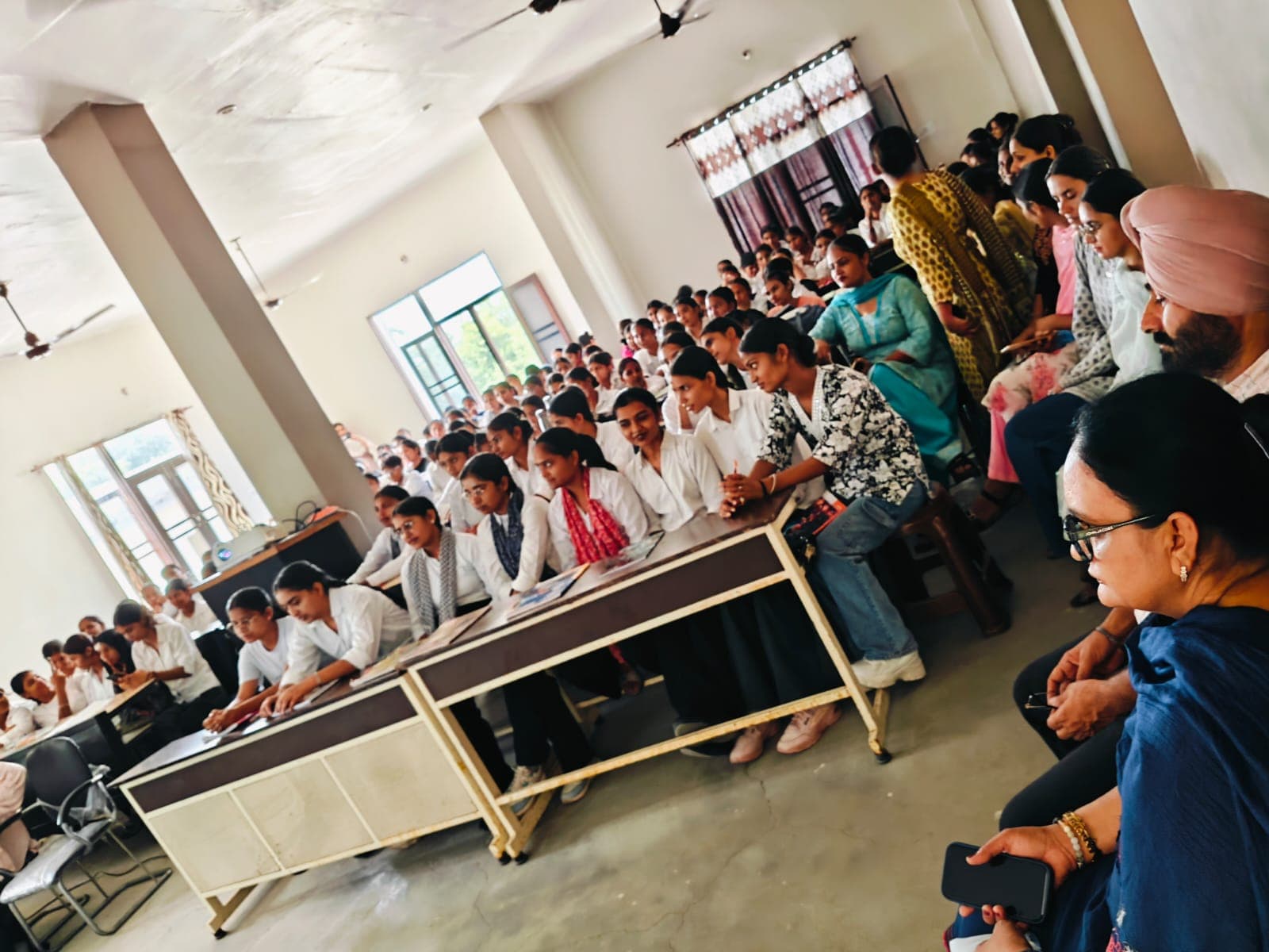 Wide view of the induction and orientation hall at Alpine College